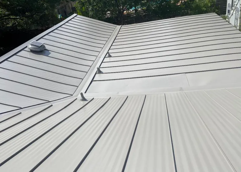 Solar attic fan installed on a metal roof for Roof Ventilation in Ellisville